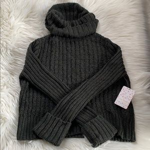 Free People “Twisted Cable” crop sweater.